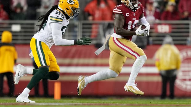 San Francisco 49ers wide receiver Deebo Samuel runs with the football against the Green Bay Packers.