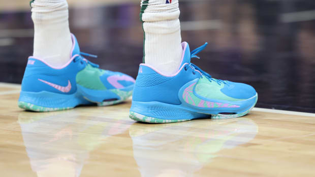 View of Giannis Antetokounmpo's blue and green Nike shoes.