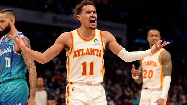 Trae Young yells at a referee.