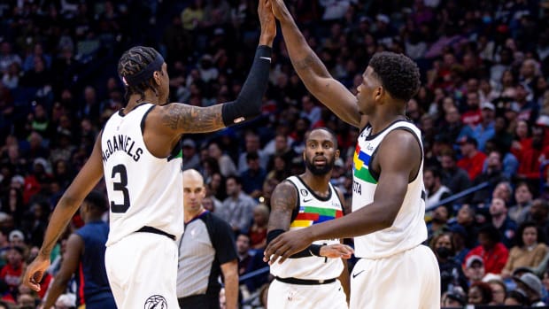 Dec 28, 2022; New Orleans, Louisiana, USA; Minnesota Timberwolves guard Anthony Edwards (1) and forward Jaden McDaniels (3) high five on a time out against the New Orleans Pelicans during the second half at Smoothie King Center.