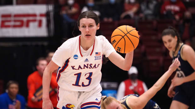 Mar 18, 2022; Stanford, California, USA; Kansas Jayhawks guard Holly Kersgieter (13) on a fast break after stealing the ball against Georgia Tech Yellow Jackets forward Digna Strautmane (45) during the second quarter at Maples Pavilion. Mandatory Credit: Kelley L Cox-USA TODAY Sports