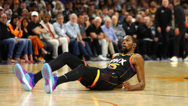 Phoenix Suns forward Kevin Durant falls to the court during a game.