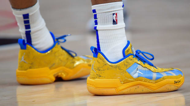 Los Angeles Clippers guard Russell Westbrook's blue and gold Jordan Brand shoes.