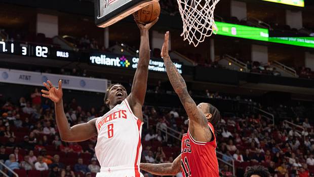 Rockets forward Jae'Sean Tate shoots against Chicago Bulls forward DeMar DeRozan (11) in the fourth quarter at Toyota Center.