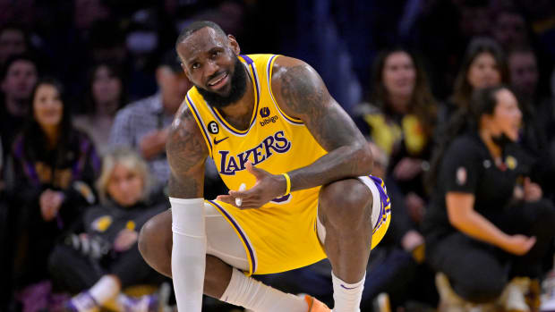 Lakers forward LeBron James squats down during a game.