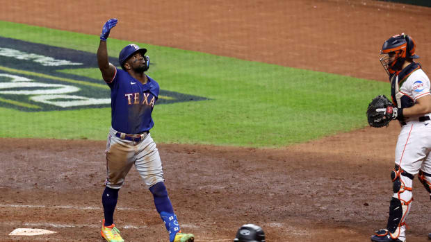 Texas Rangers right fielder Adolis Garcia celebrates after hitting a home run during the eighth inning of Game 7 of the ALCS against the Houston Astros on Oct. 23 at Minute Maid Park.