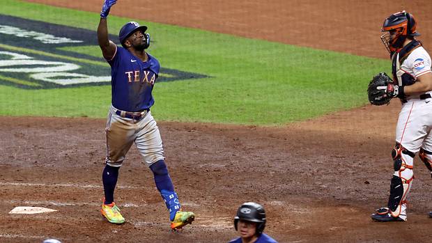 Texas Rangers right fielder Adolis Garcia celebrates after hitting a home run during the eighth inning of Game 7 of the ALCS against the Houston Astros on Oct. 23 at Minute Maid Park.