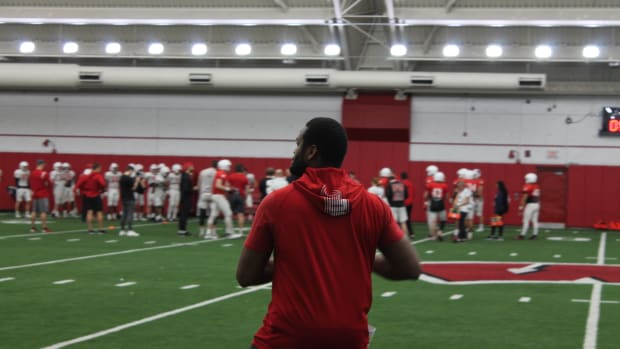 Wisconsin wide receivers coach Alvis Whitted throwing the football during spring practice.