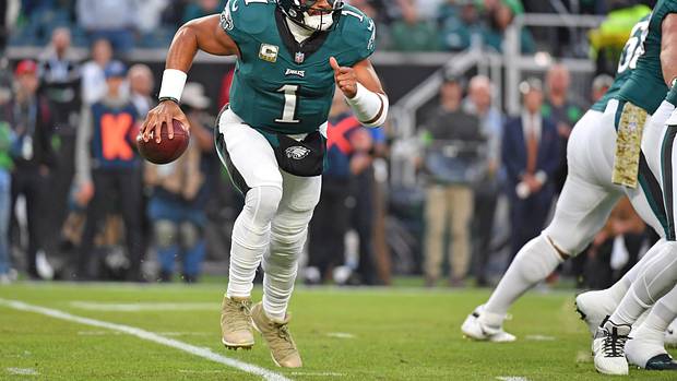 Philadelphia Eagles quarterback Jalen Hurts runs with the ball against the Dallas Cowboys.