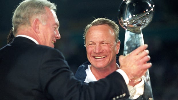 Dallas Cowboys owner Jerry Jones and head coach Barry Switzer hold the Lombardi trophy after a victory against the Pittsburgh Steelers in Super Bowl XXX at Sun Devil Stadium. Dallas defeated Pittsburgh 27-17.