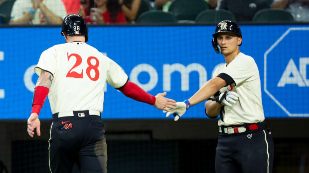 Jul 15, 2023; Arlington, Texas, USA; Texas Rangers catcher Jonah Heim (28) celebrates with teammates Texas Rangers shortstop Corey Seager (5) after scoring during the second inning against the Cleveland Guardians at Globe Life Field. Mandatory Credit: Kevin Jairaj-USA TODAY Sports