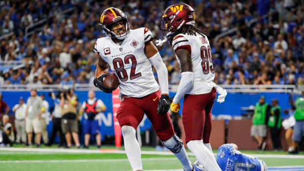 Washington Commanders tight end Logan Thomas (82) and receiver Cam Sims (89) celebrate a play against the Detroit Lions.