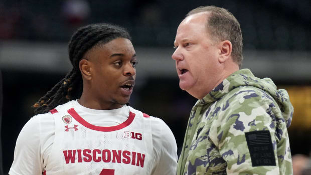 Wisconsin point guard Kamari McGee speaking with Greg Gard during the Brew City Battle in Milwaukee.