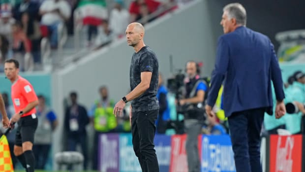 Gregg Berhalter looks on during a World Cup match.
