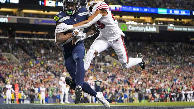 Seattle Seahawks wide receiver D.K. Metcalf (14) catches a touchdown against San Francisco 49ers cornerback Ahkello Witherspoon (23) during the fourth quarter at CenturyLink Field.