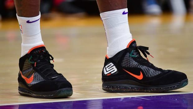 Los Angeles Lakers forward LeBron James' black and orange Nike sneakers.