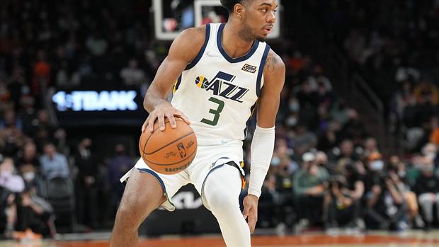 Utah Jazz guard Trent Forrest dribbles the ball.
