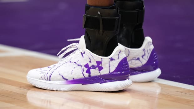 Sacramento Kings guard De'Aaron Fox's purple and white Under Armour sneakers.