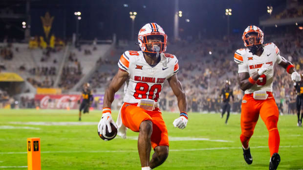 Sep 9, 2023; Tempe, Arizona, USA; Oklahoma State Cowboys wide receiver Brennan Presley (80) celebrates after scoring a touchdown against the Arizona State Sun Devils in the second half at Mountain America Stadium. Mandatory Credit: Mark J. Rebilas-USA TODAY Sports