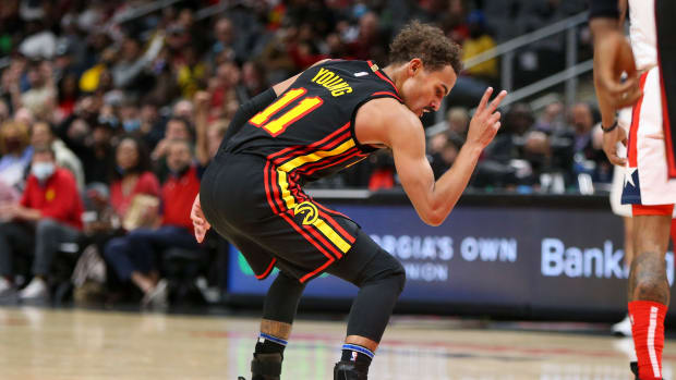 Atlanta Hawks guard Trae Young (11) celebrates after a made basket against the Washington Wizards in the second half at State Farm Arena.