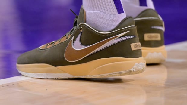 Anthony Davis' green and tan Nike LeBron shoes.