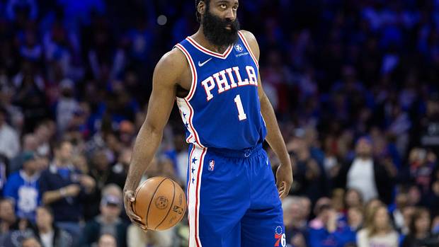 James Harden standing with the basketball.