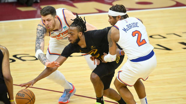 Mar 3, 2024; Cleveland, Ohio, USA; Cleveland Cavaliers guard Darius Garland (10) loses the ball while defended by New York Knicks center Isaiah Hartenstein (55) and guard Miles McBride (2) in the fourth quarter at Rocket Mortgage FieldHouse. Mandatory Credit: David Richard-USA TODAY Sports