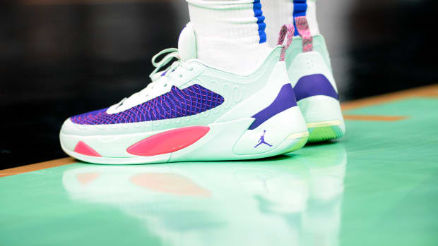 View of Luka Doncic's green and purple shoes.