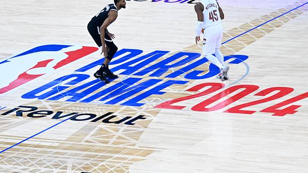 Cleveland Cavaliers guard Donovan Mitchell dribbles against Brooklyn Nets forward Mikal Bridges.