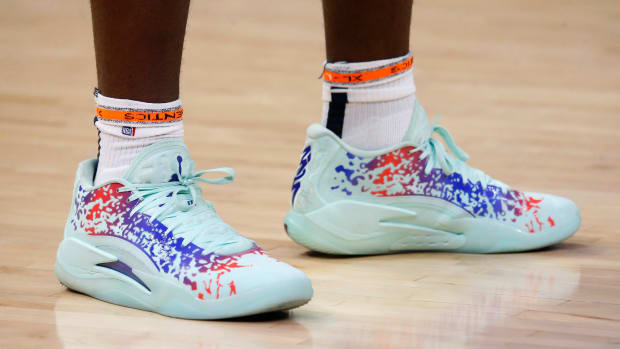 New Orleans Pelicans forward Zion Williamson's teal and blue Jordan brand sneakers.
