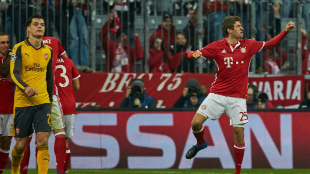 Thomas Muller pictured (right) celebrating after scoring a goal for Bayern Munich in a 5-1 win over Arsenal in February 2017