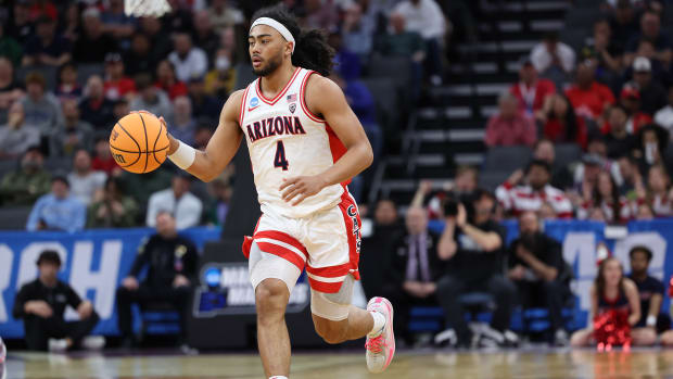 Arizona Wildcats guard Kylan Boswell dribbles the ball down the court.
