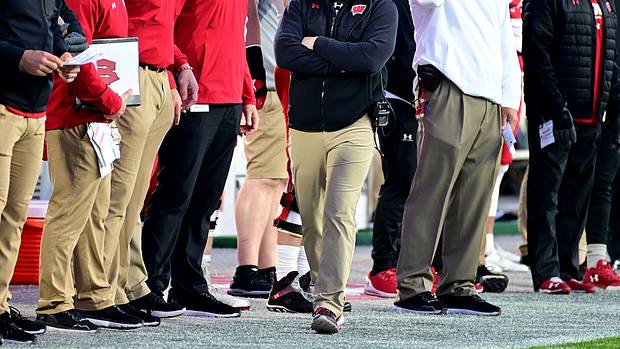 Wisconsin interim head coach Jim Leonhard walking on the sidelines.
