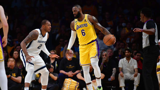Memphis Grizzlies forward Xavier Tillman defends Los Angeles Lakers forward LeBron James.