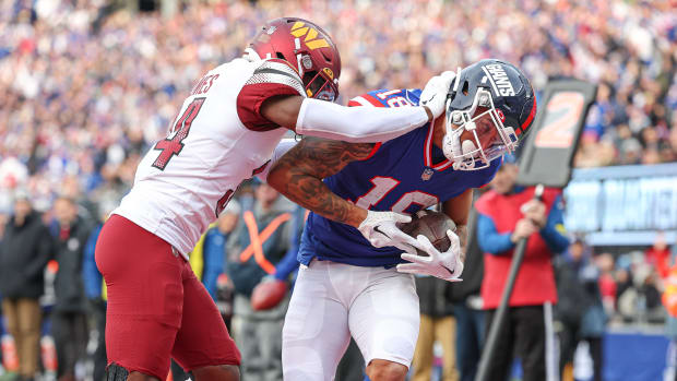 Washington Commanders cornerback Christian Holmes (34) attempts to defend a play against the New York Giants.