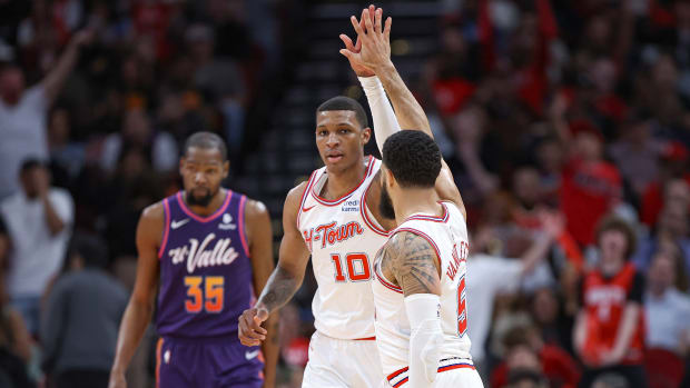 Phoenix Suns forward Kevin Durant (35) reacts and Houston Rockets guard Fred VanVleet (5) celebrates with forward Jabari Smith Jr. (10) after a play during the third quarter at Toyota Center.