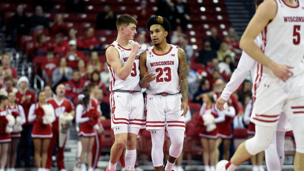 Wisconsin guards Connor Essegian and Chucky Hepburn talk during their game against Lehigh.