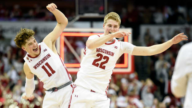 Wisconsin players Steven Crowl and Max Klesmit celebrate beating Maryland.