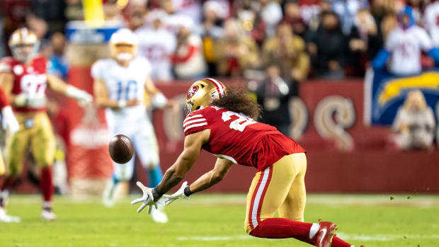 November 13, 2022; Santa Clara, California, USA; San Francisco 49ers safety Talanoa Hufanga (29) intercepts the football against Los Angeles Chargers quarterback Justin Herbert (10) during the fourth quarter at Levi's Stadium. Mandatory Credit: Kyle Terada-USA TODAY Sports