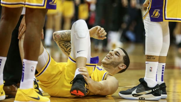 Jan 19, 2019; Houston, TX, USA; Los Angeles Lakers guard Lonzo Ball (2) holds his leg after a play during the third quarter against the Houston Rockets at Toyota Center.
