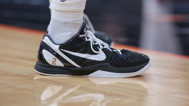 Black and white Nike Kobe shoes.
