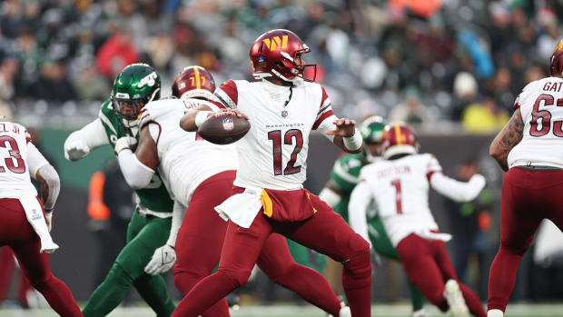 Washington Commanders quarterback Jacoby Brissett (12) throws the ball during the second half against the New York Jets at MetLife Stadium.