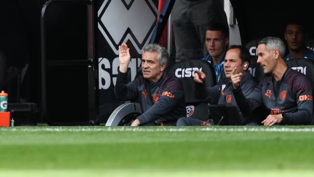 Manchester City's coaching staff, including assistant manager Juanma Lillo (left), pictured on the bench during the team's 2-1 win at Sheffield United in August 2023