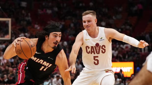 Dec 8, 2023; Miami, Florida, USA; Miami Heat guard Jaime Jaquez Jr. (11) drives the ball around Cleveland Cavaliers guard Sam Merrill (5) during the first half at Kaseya Center. Mandatory Credit: Jasen Vinlove-USA TODAY Sports