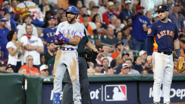 Texas Rangers center fielder Leody Taveras reacts at third after hitting a triple in the sixth inning against the Houston Astros during Game 2 of the ALCS at Minute Maid Park.