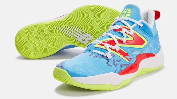 View of blue, red, and green New Balance shoes.