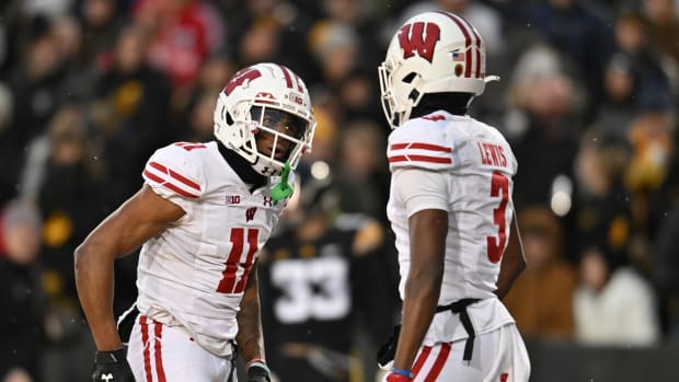 Wisconsin wide receivers Skyler Bell and Keontez Lewis celebrate a touchdown against Iowa.