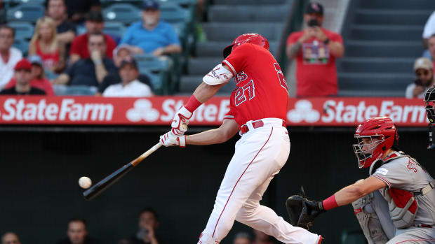 Aug 22, 2023; Anaheim, California, USA; Los Angeles Angels center fielder Mike Trout (27) pops out to second during the first inning against the Cincinnati Reds at Angel Stadium. Mandatory Credit: Kiyoshi Mio-USA TODAY Sports  