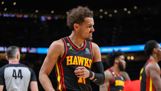 Atlanta Hawks guard Trae Young reacts during a timeout.