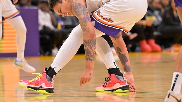 Phoenix Mercury center Brittney Griner falls down on the court.